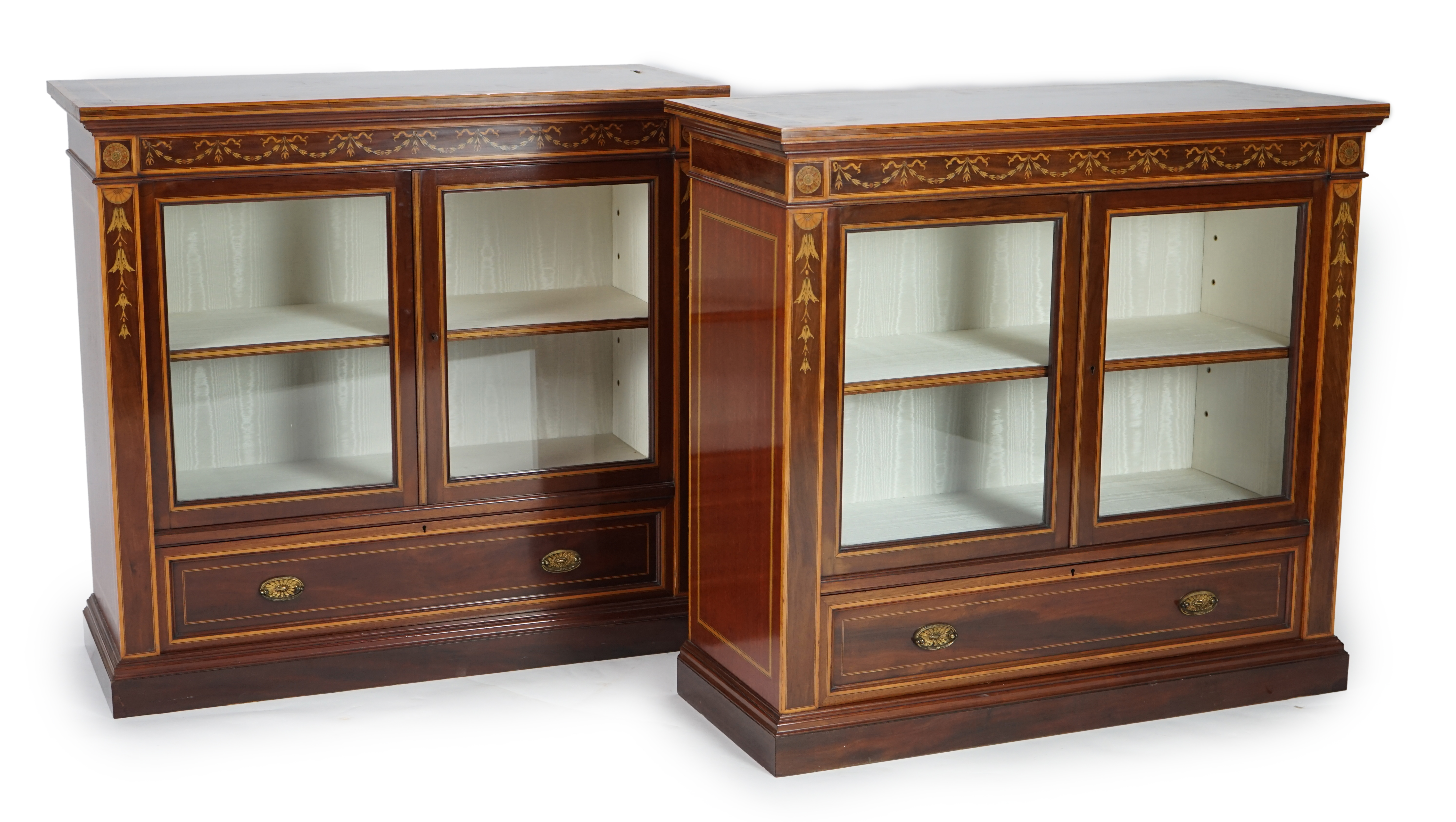 A pair of Edwardian marquetry inlaid and satinwood banded mahogany side cabinets, by Gillows